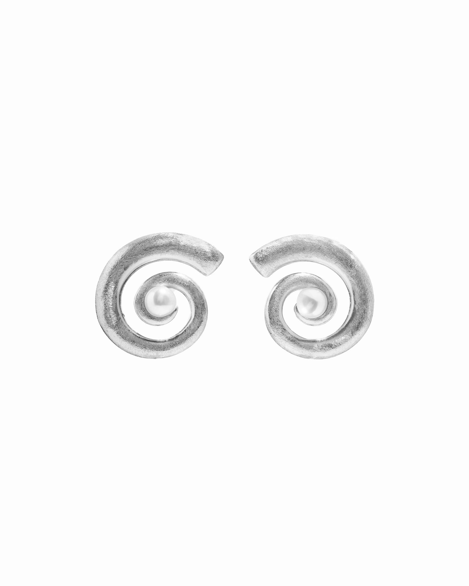 closeup image of gold and pearl earrings