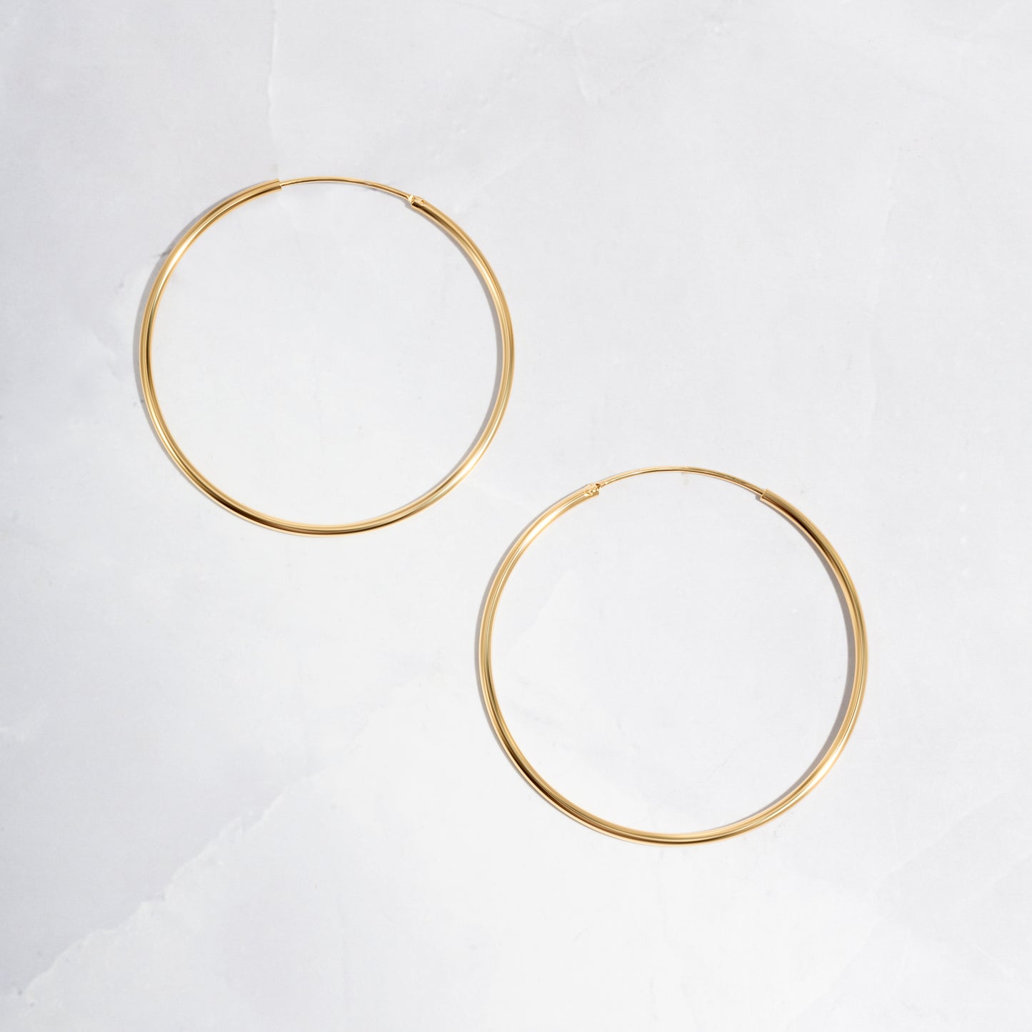 closeup image of dainty hoop earrings