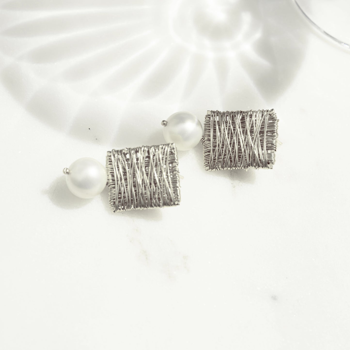 bohemian jewelry featuring silver pearl charm earrings