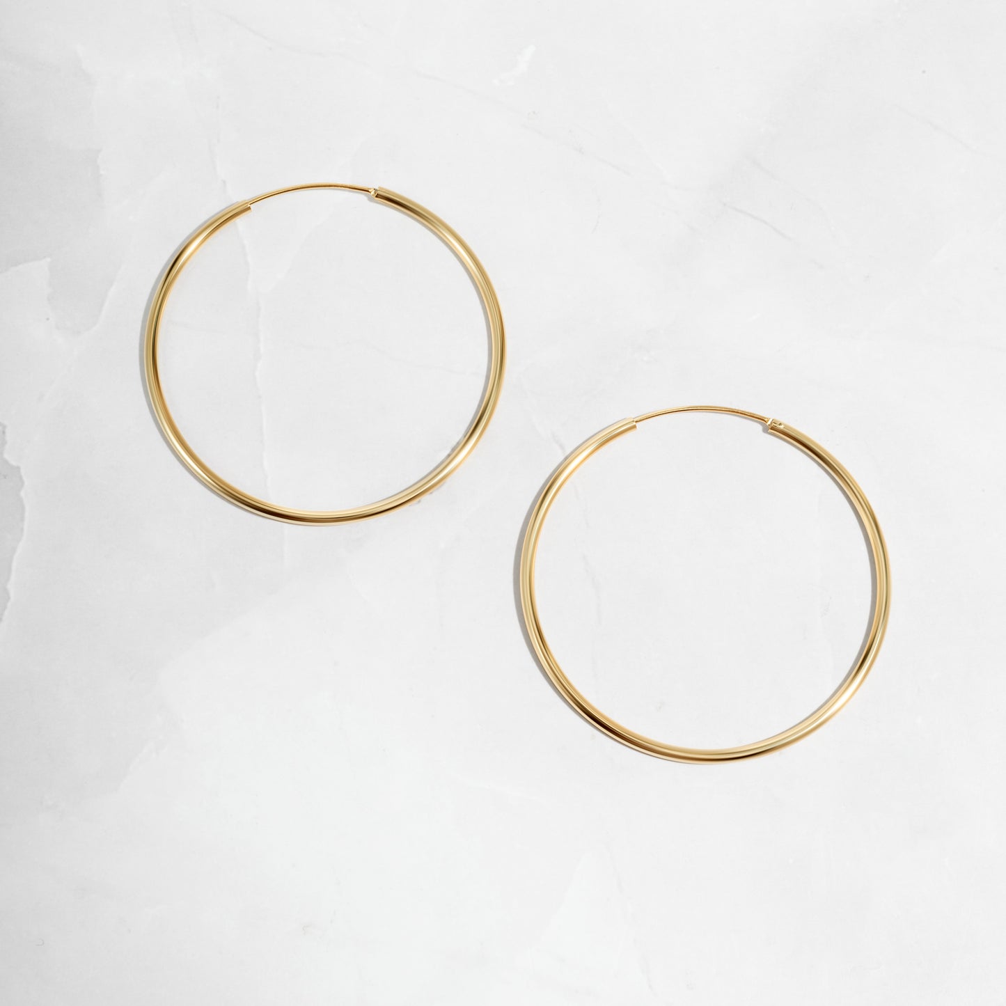 Skinny Hoop earrings in gold