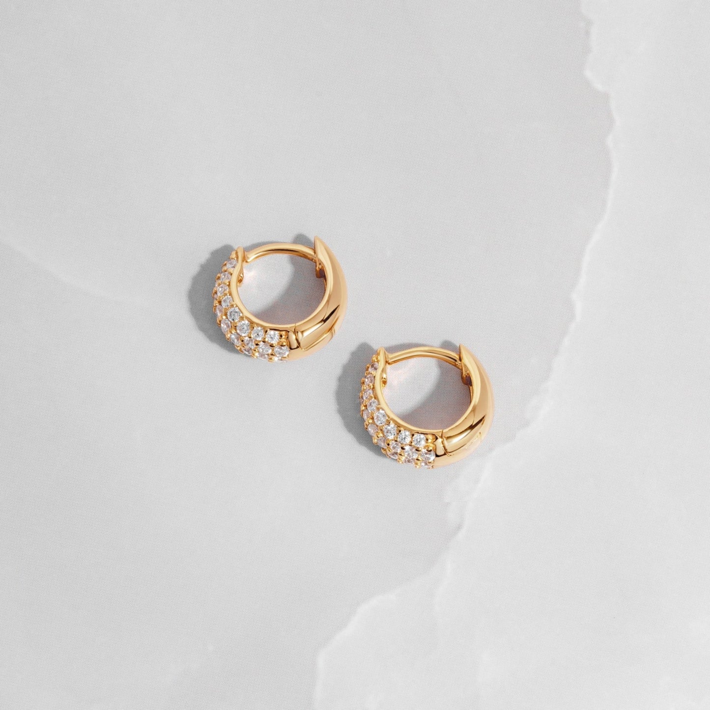 Small Pave Hoop Earrings on White background with gold plating
