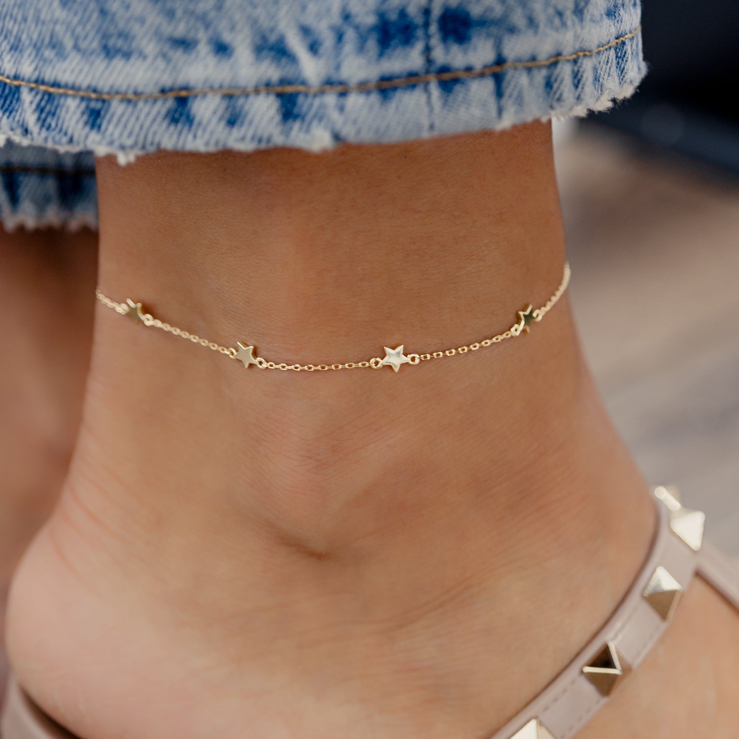 star ankle bracelet on model