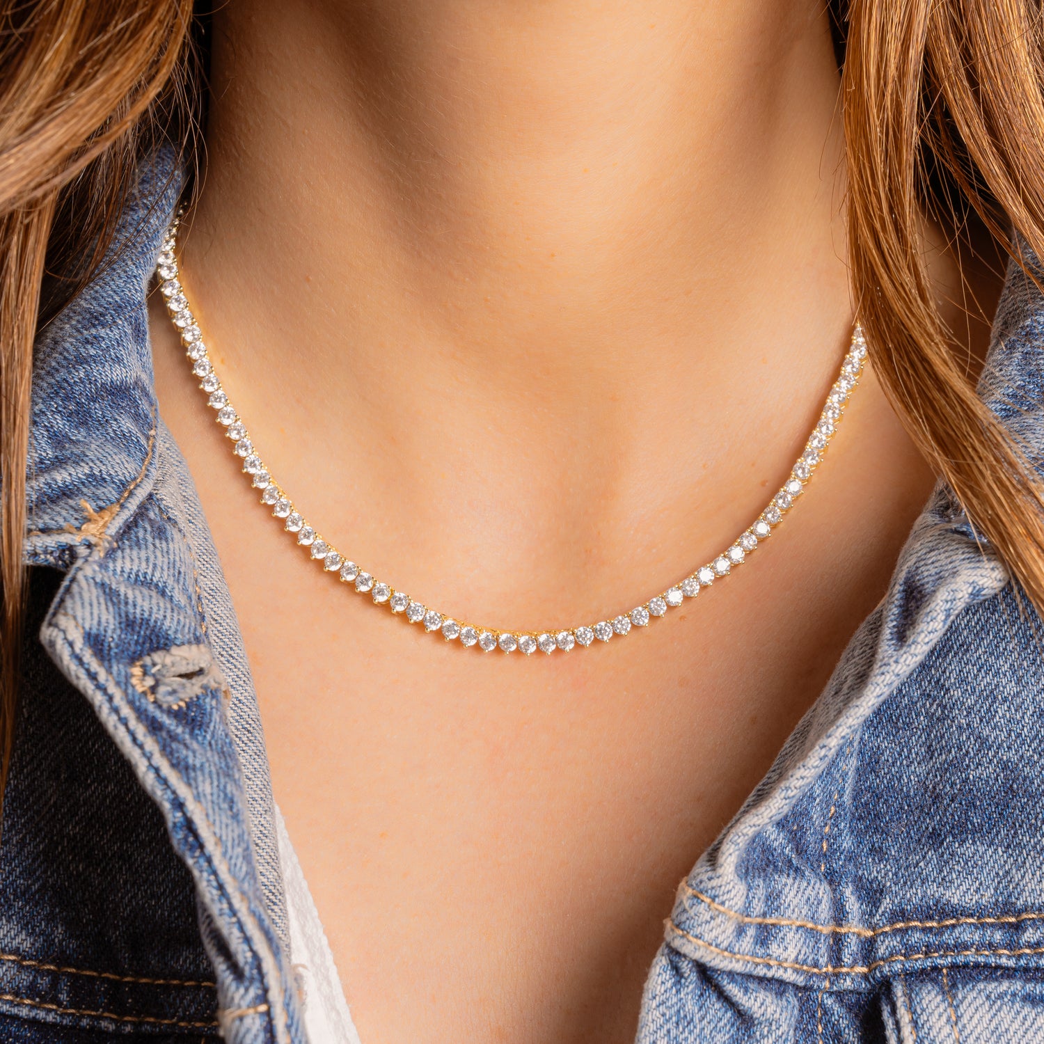 a close up of a person wearing a necklace
