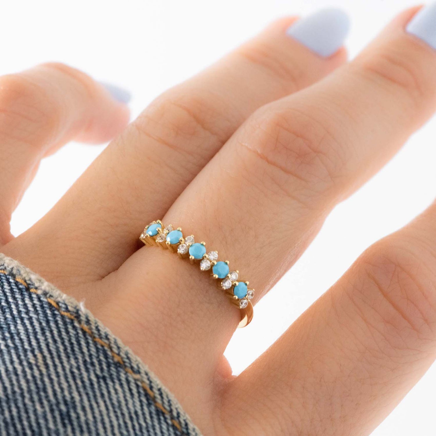 Delicate turquoise and diamond ring on model