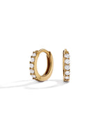 14K solid gold 7mm diamond huggie earrings on white background