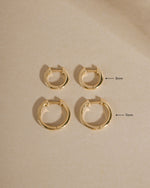 14K solid gold pavé lab-grown diamond huggie hoop earrings, 11mm size, with sparkling diamond accents by Sami Jewels.