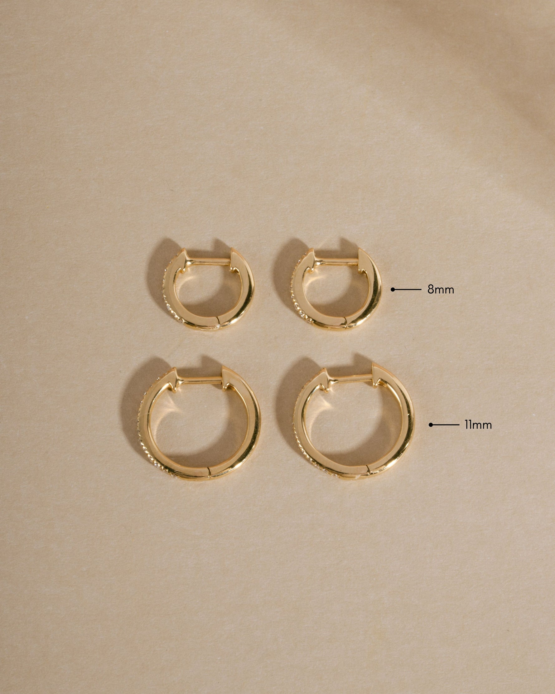 14K solid gold pavé lab-grown diamond huggie hoop earrings, 11mm size, with sparkling diamond accents by Sami Jewels.