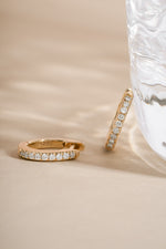 Pair of 14K solid gold 8mm pavé huggie earrings with lab grown diamond details