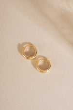 14K solid gold chunky huggie hoop earrings with a bold profile, featuring a sleek and modern design by Sami Jewels.