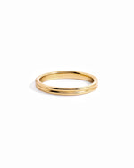 14K solid gold double band ring with layered minimalist design on white background