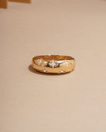 14k gold dome ring with star set lab grown diamonds, modern statement ring on neutral background