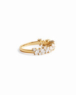 Side view of 14K solid gold multi stone diamond ring on white background