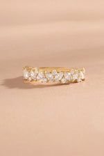 Solid 14k gold multi stone lab diamond ring on neutral background