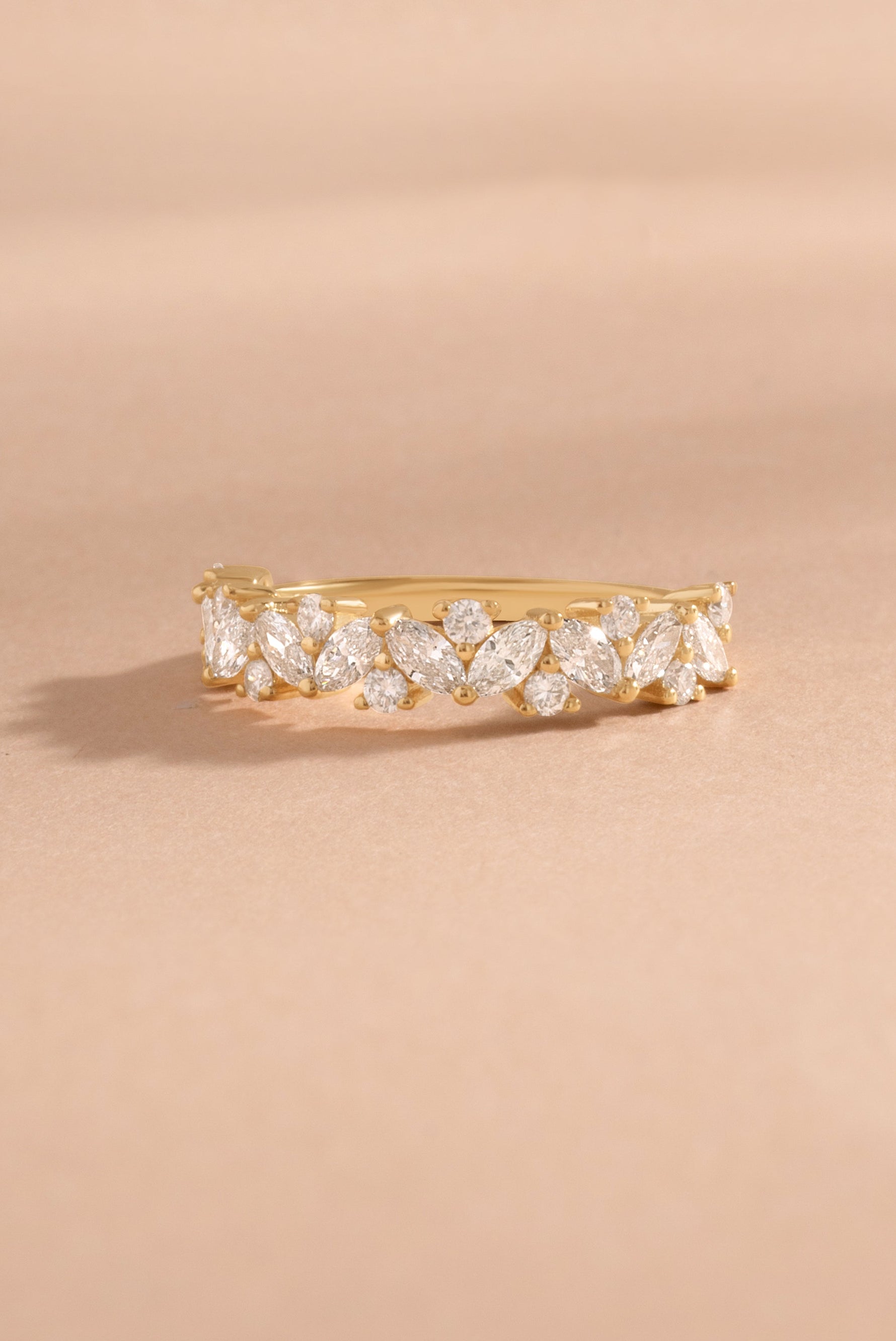 Solid 14k gold multi stone lab diamond ring on neutral background