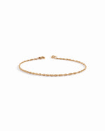 14K solid gold twisted rope chain bracelet with lobster clasp on white background