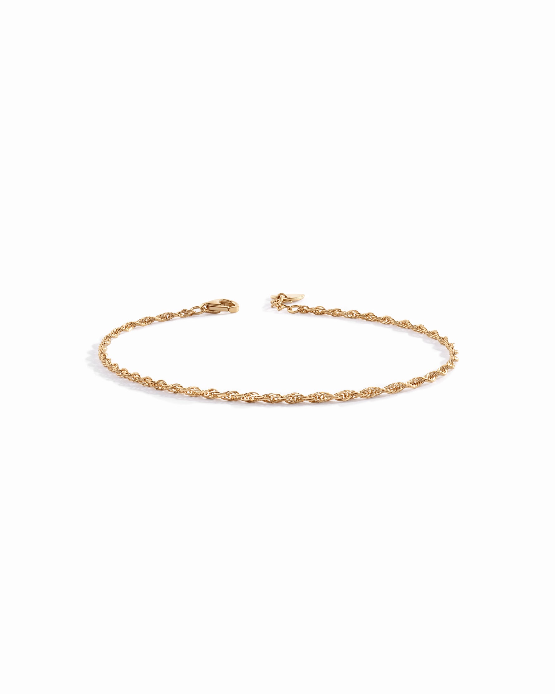 14K solid gold twisted rope chain bracelet with lobster clasp on white background