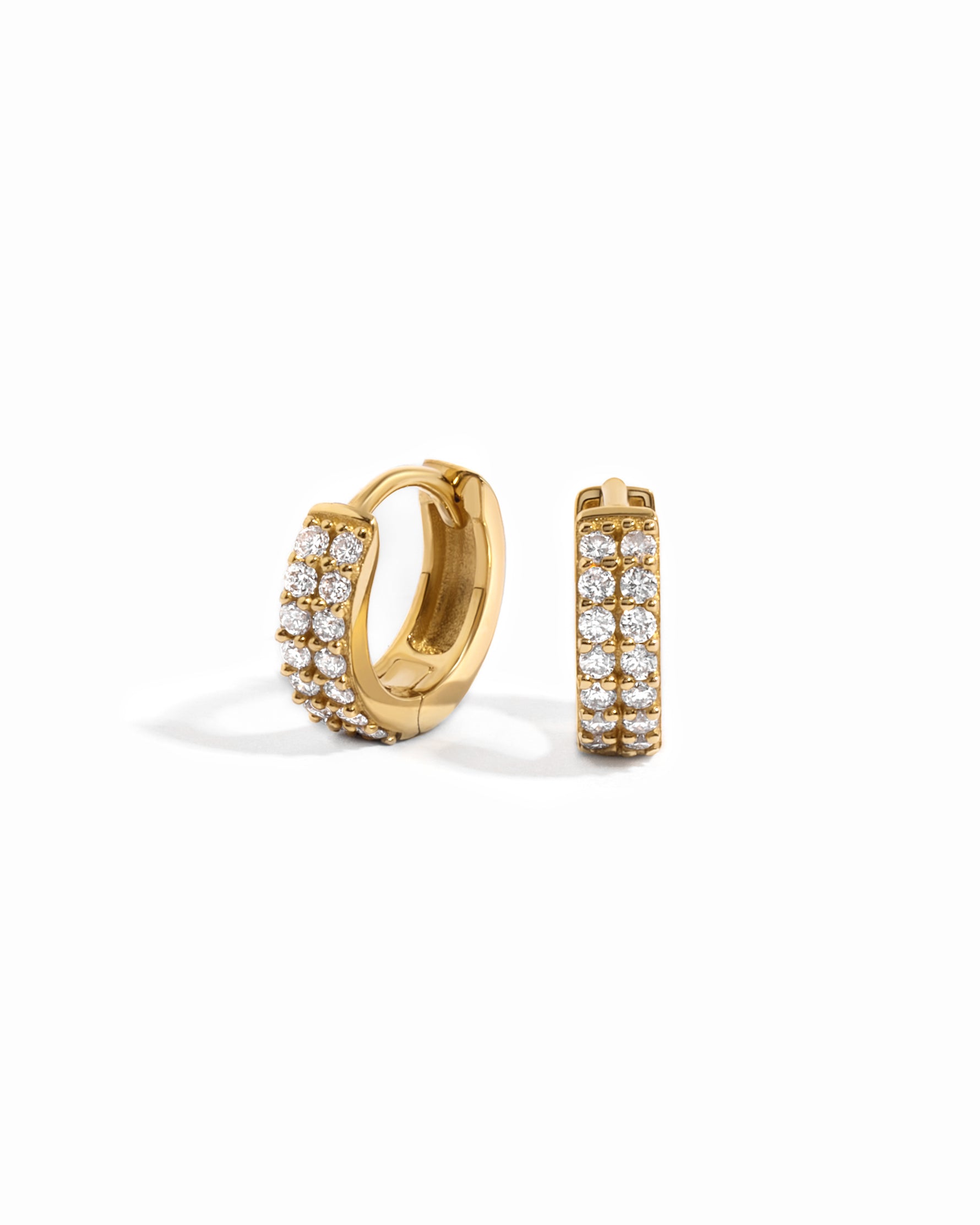 14K solid gold hoop earrings with two rows of diamond accents on a white background