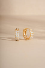 14K solid gold double row huggies with side view on neutral background