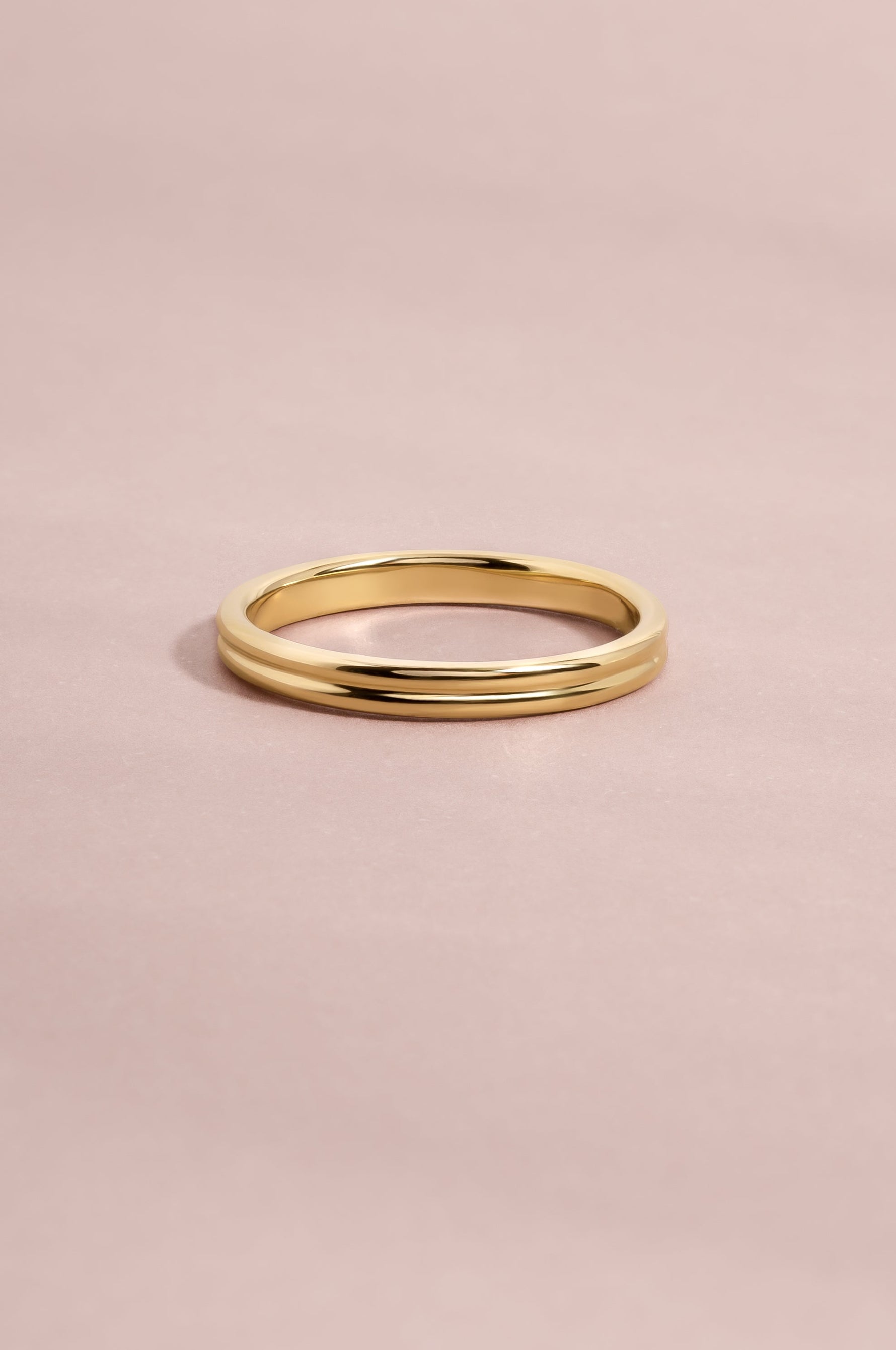 14K solid gold double row band on light pink background