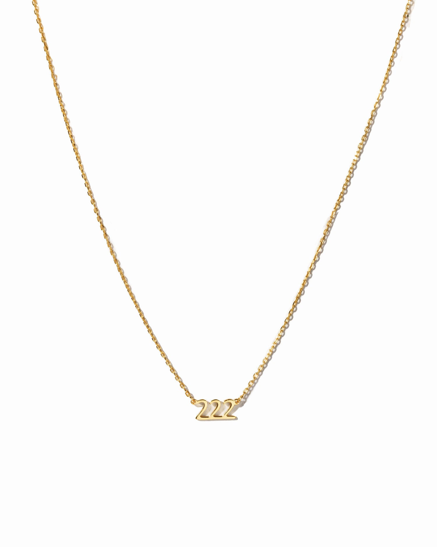 Gold angel number 222 necklace by Sami Jewels displayed on a white background, showcasing a delicate jewelry piece with number pendant.