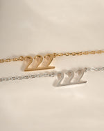 Sterling silver and gold angel number 222 necklace by Sami Jewels with a pendant featuring the number 222.