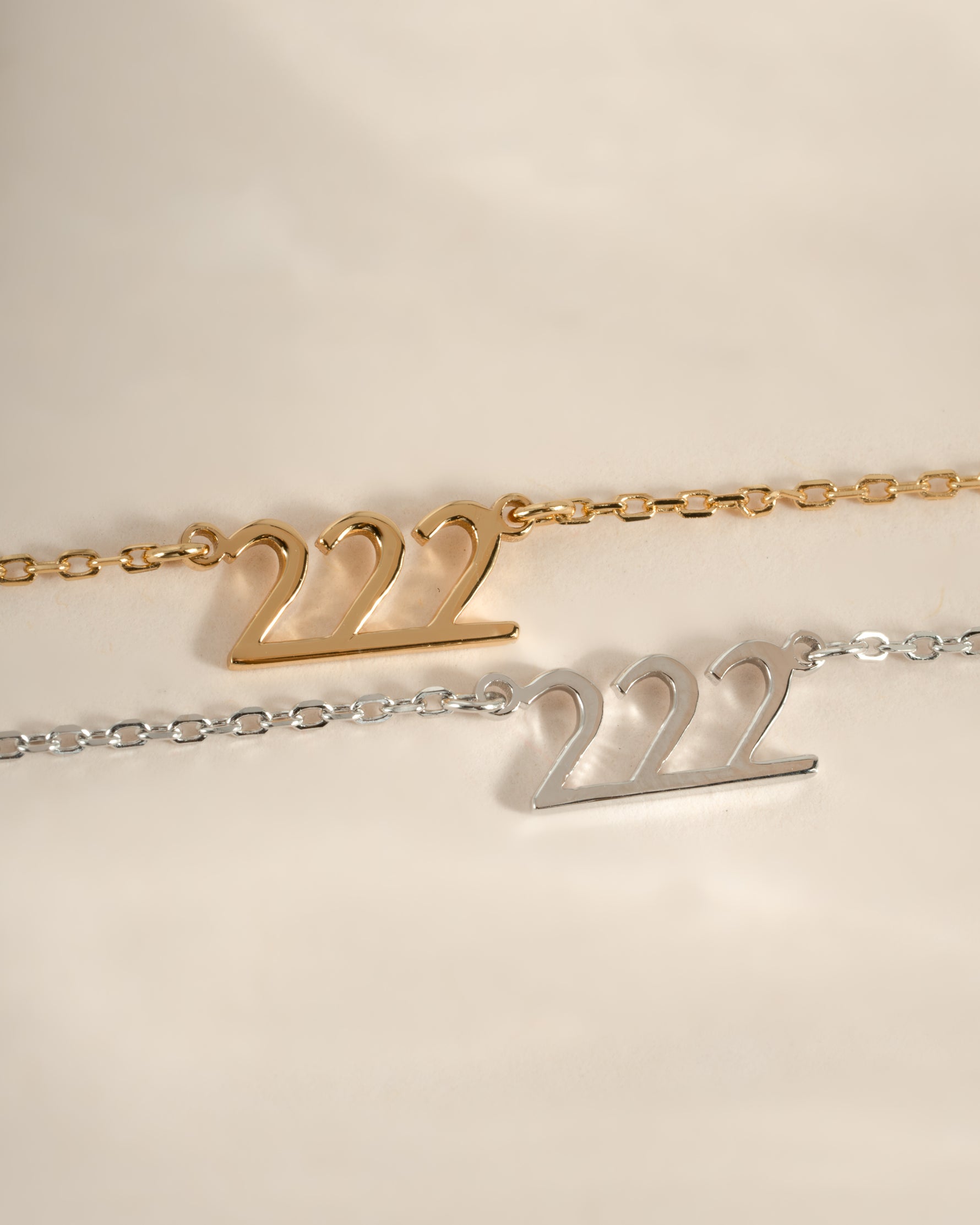 Sterling silver and gold angel number 222 necklace by Sami Jewels with a pendant featuring the number 222.