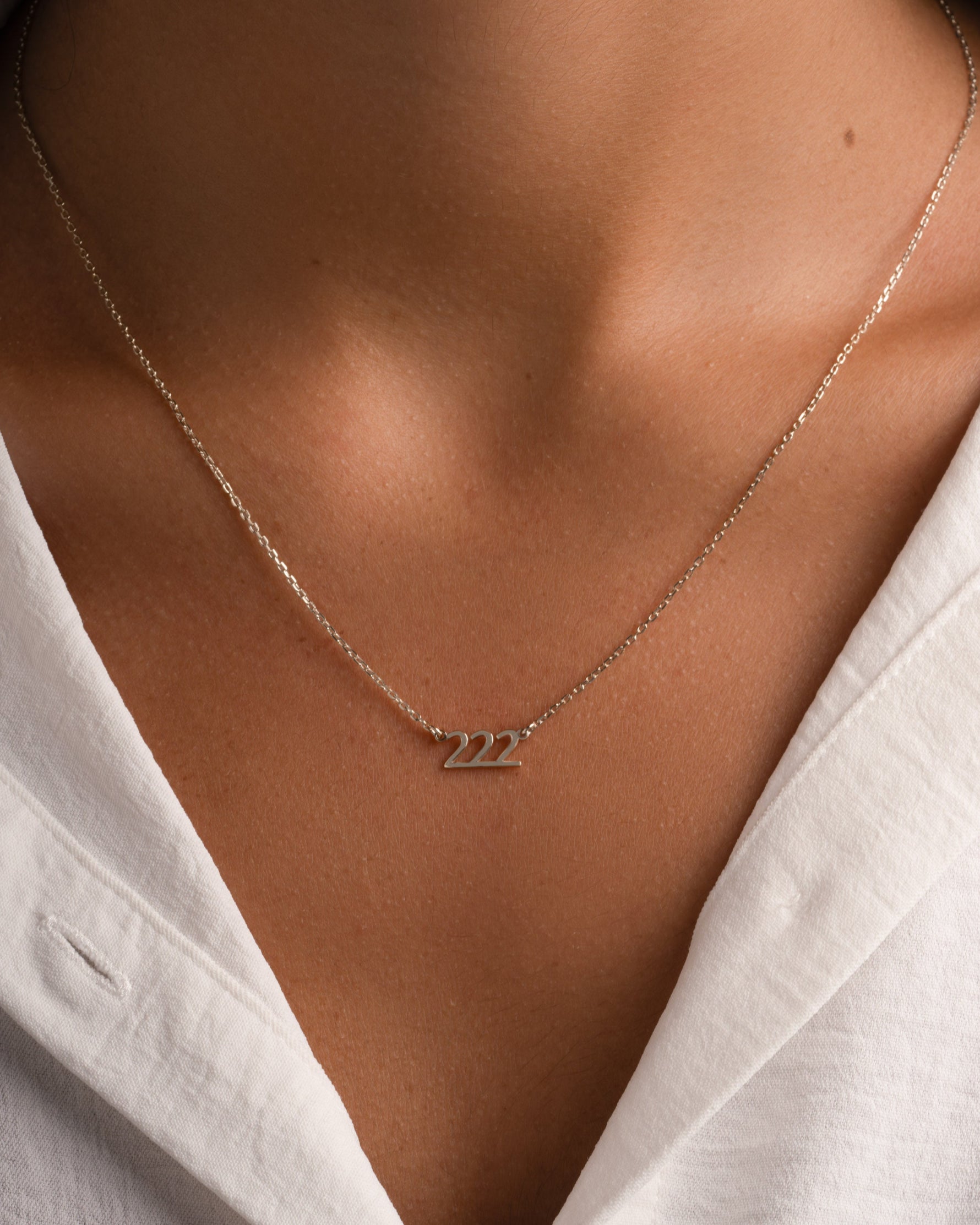 Sterling silver angel number 222 necklace by Sami Jewels, featuring a delicate pendant on a fine chain.