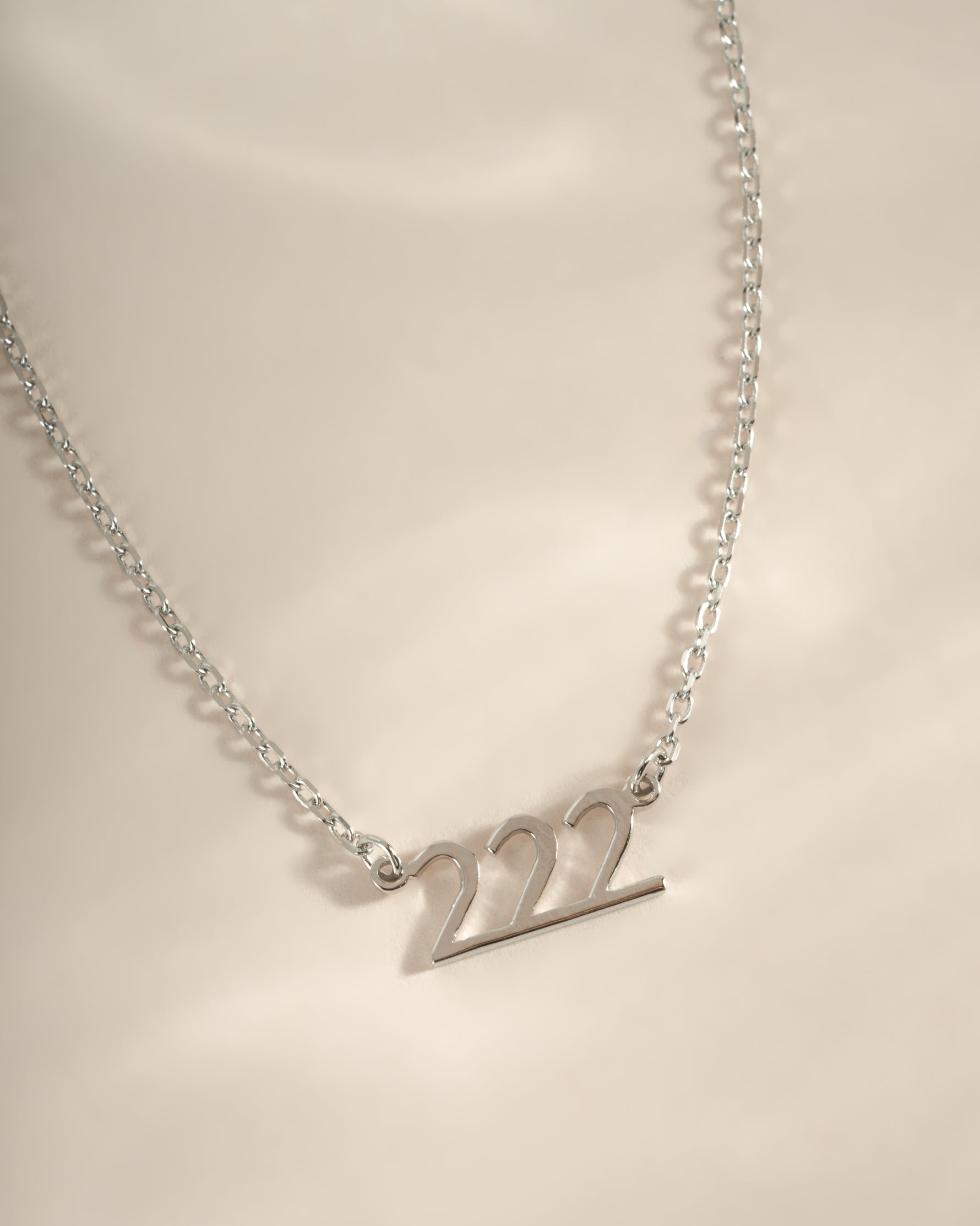Sterling silver angel number 222 necklace by Sami Jewels featuring a delicate pendant on a chain.