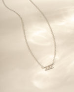 Sterling silver angel number 222 necklace by Sami Jewels, featuring a delicate pendant with engraved angel number design.