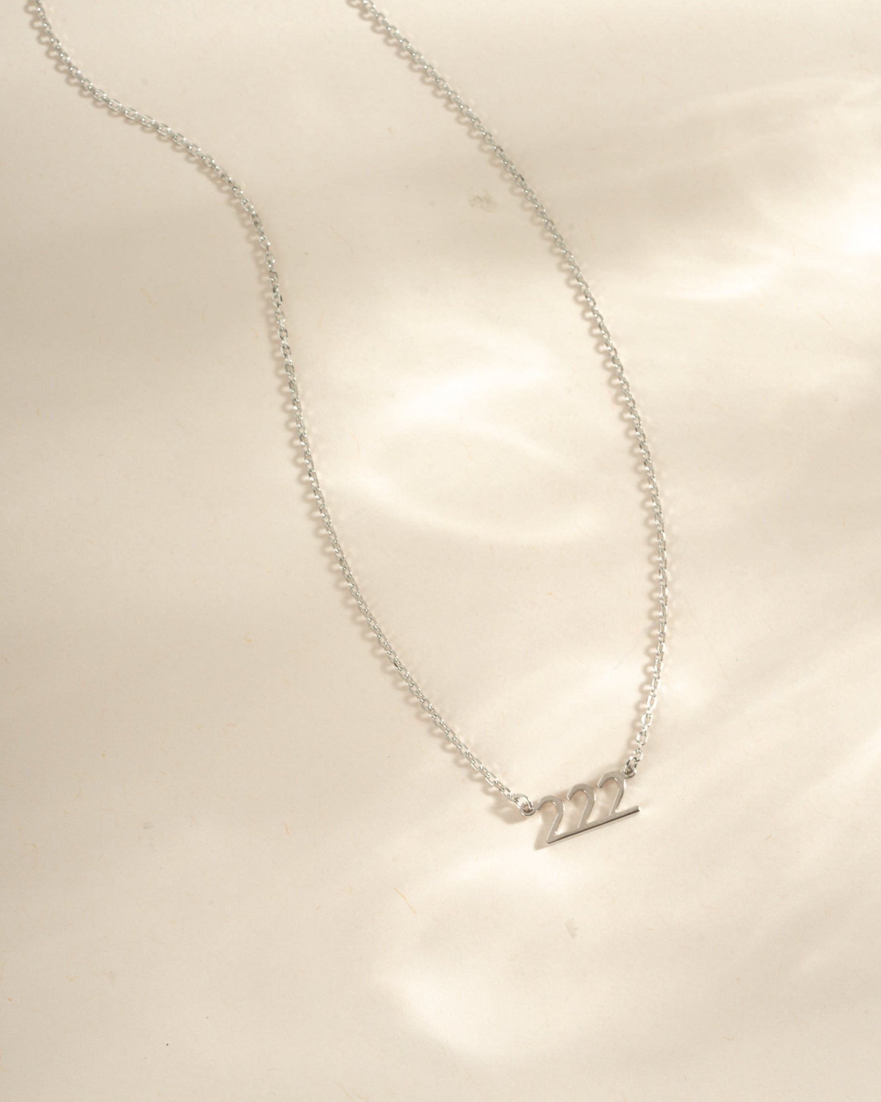 Sterling silver angel number 222 necklace by Sami Jewels, featuring a delicate pendant with engraved angel number design.
