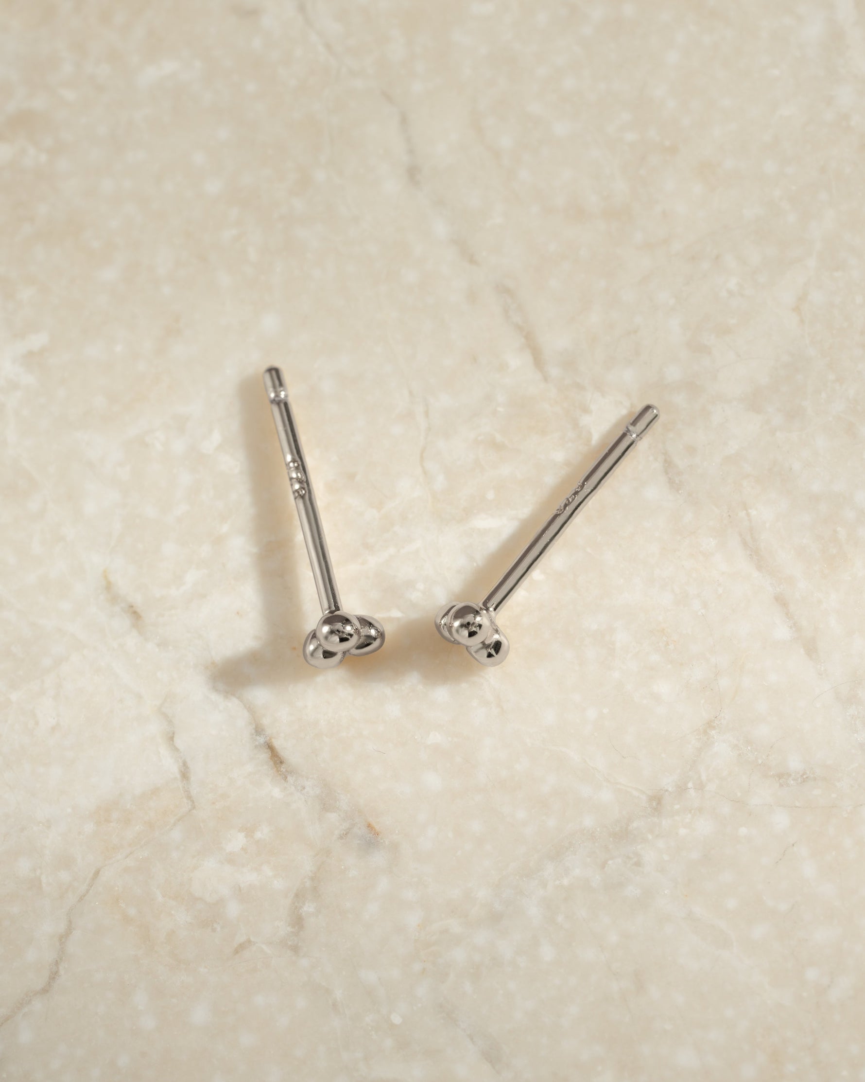 Sterling silver 3-ball stud earrings from Sami Jewels featuring three small round ball designs on each earring.