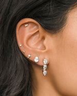 Sterling silver 3-ball stud earrings by Sami Jewels worn on model, minimalist and stylish jewelry accessory.