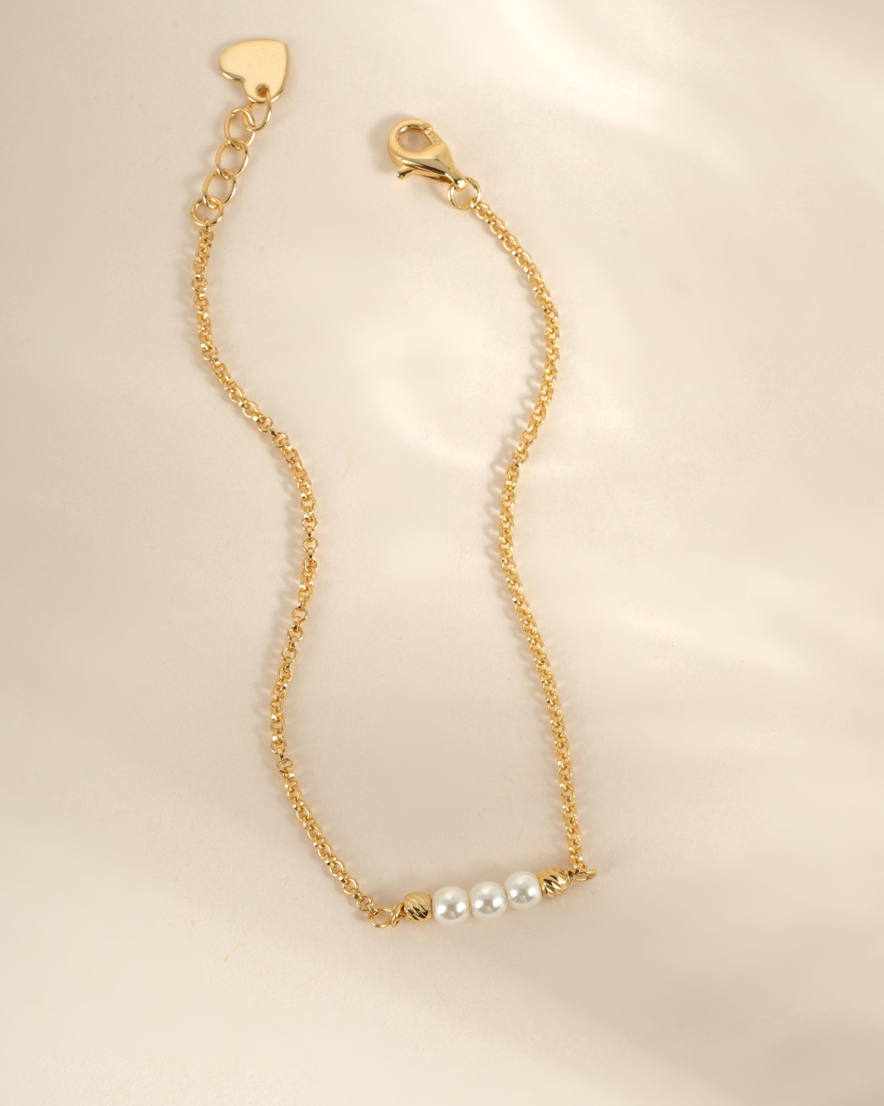 Close-up of Sami Jewels 3 Pearl Bracelet with gold accents, showcasing elegant white pearls and delicate design for women.