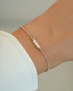 Sterling silver bracelet with three white pearls from Sami Jewels, featuring elegant, classic jewelry design.