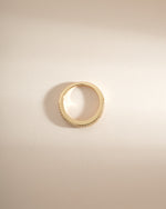 Gold 3-row diamond ring by Sami Jewels, showcasing sparkling diamonds and intricate design from a top view.