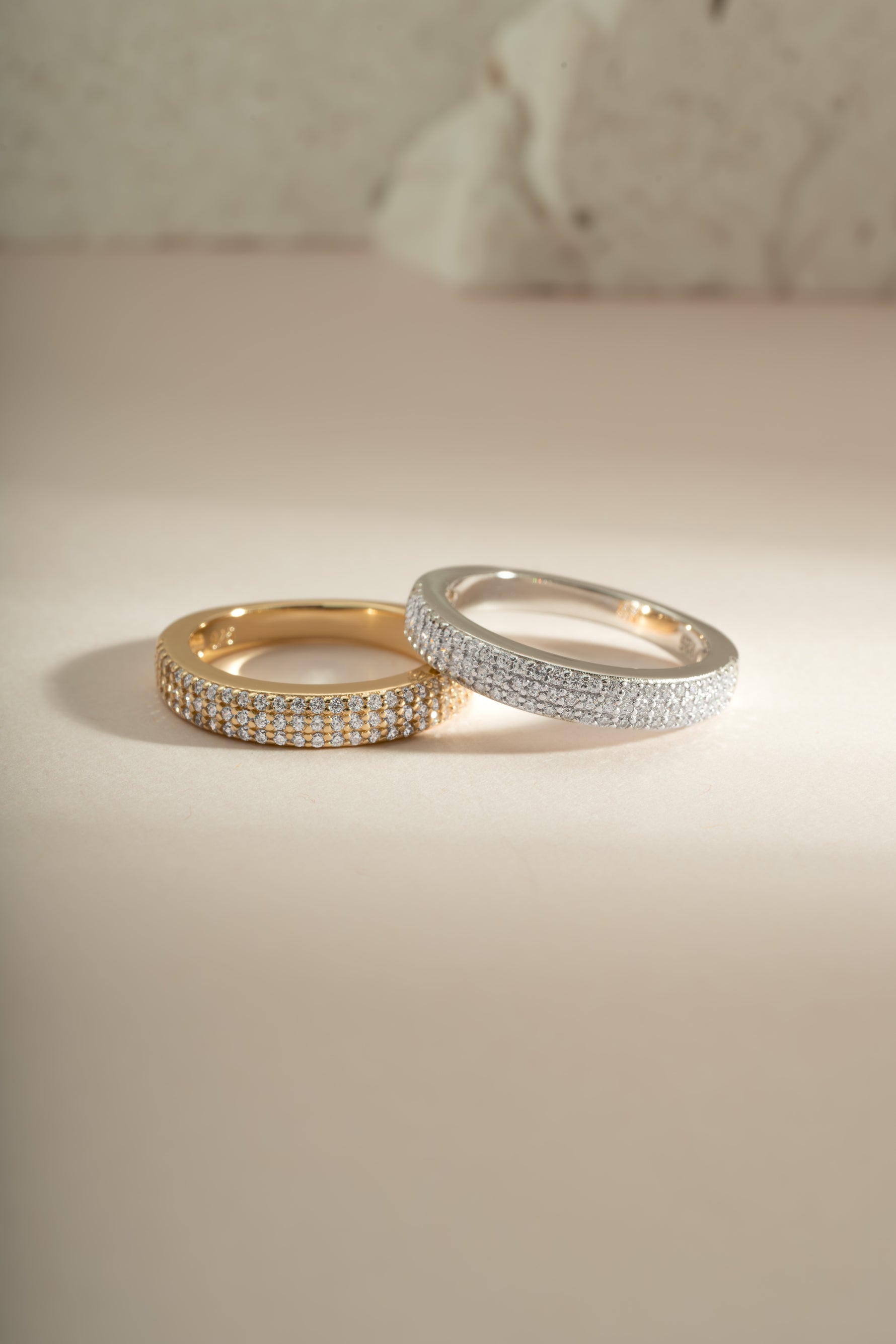 Sami Jewels 3-row diamond ring featuring sterling silver and gold accents, showcasing a layered and sparkling design.