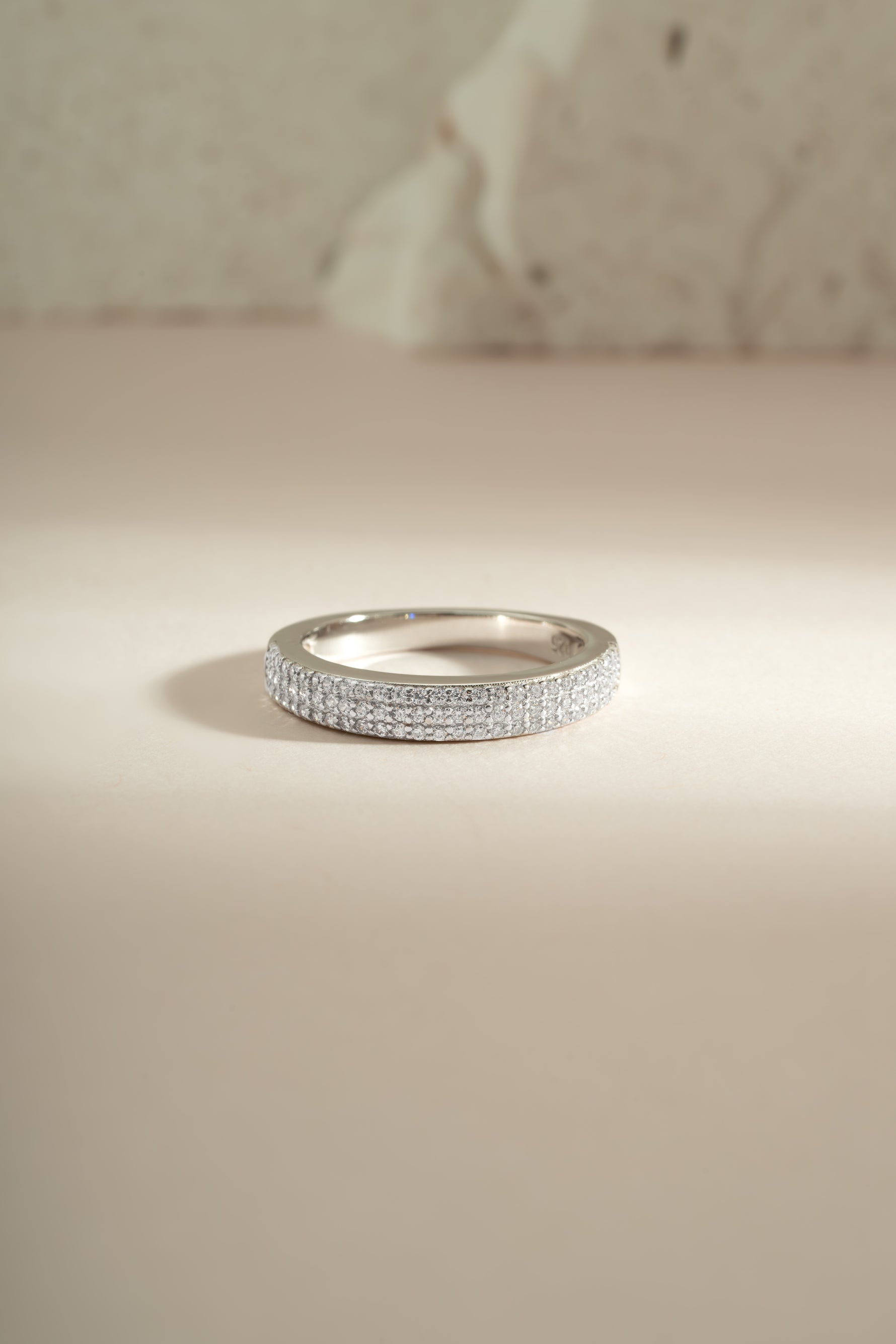 Sterling silver 3-row diamond ring by Sami Jewels featuring multiple sparkling diamond-studded bands.