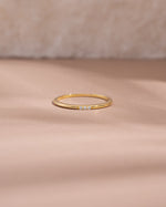 3 stone cubic zirconia stacking ring in gold front view
