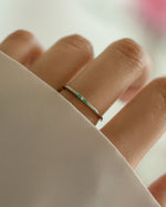 3 stone emerald ring in sterling silver on models hand