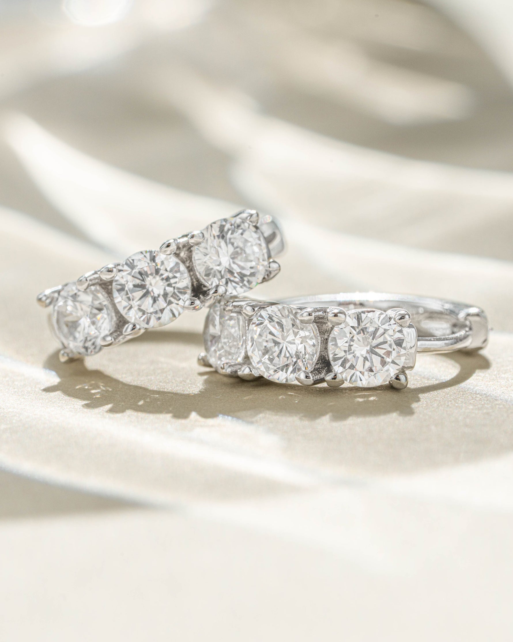 Sterling silver Bella 3 Stone Huggie Hoops earrings with sparkling stone details from Sami Jewels
