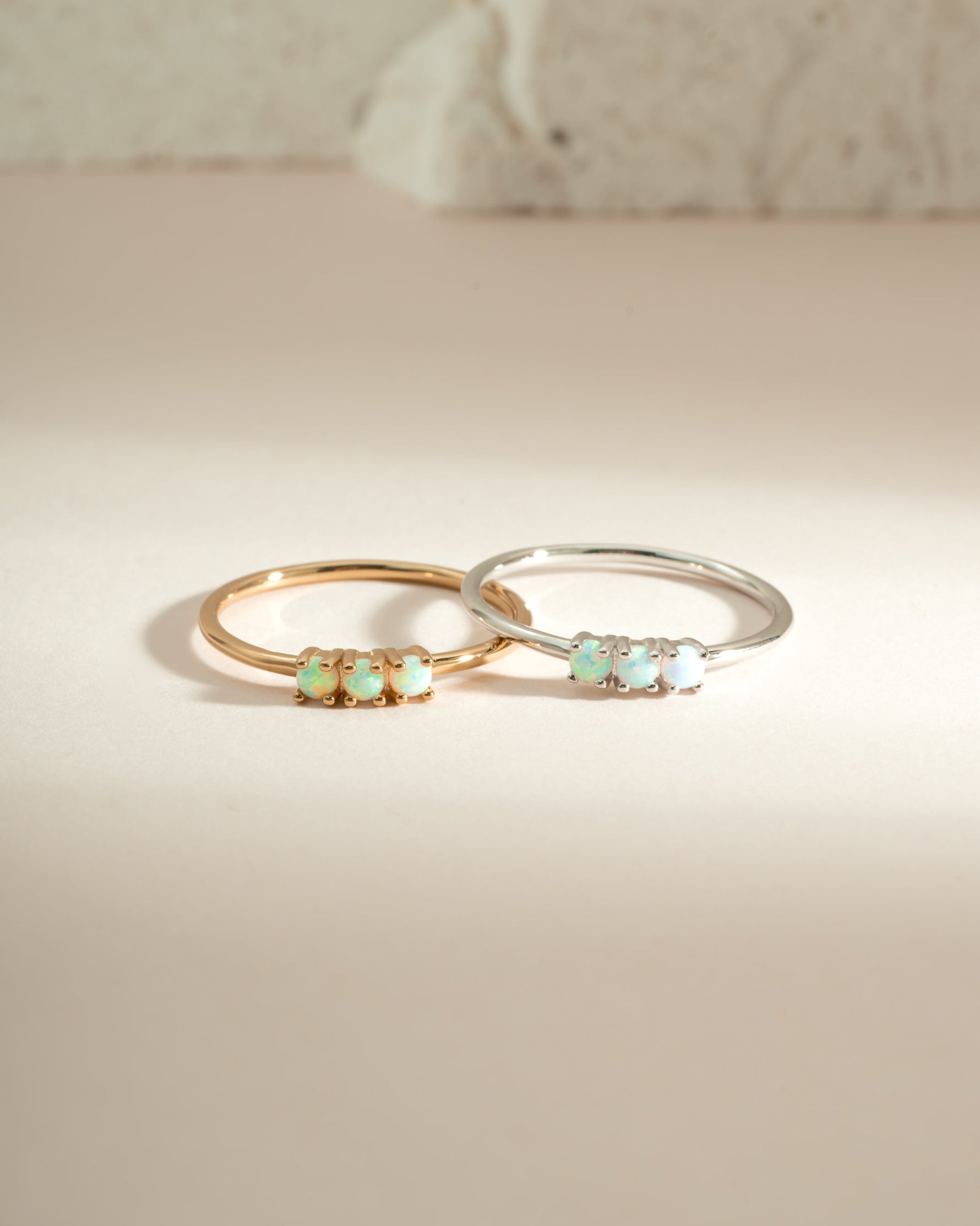 Sami Jewels 3-stone opal ring featuring gold and sterling silver band with vibrant opal gemstones.