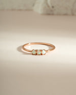 Sami Jewels 3 Stone Opal Ring featuring three vibrant opal gemstones set in a rose gold band.