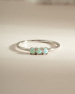 Sterling silver 3-stone opal ring from Sami Jewels showcasing vibrant, colorful opals set in a sleek band.