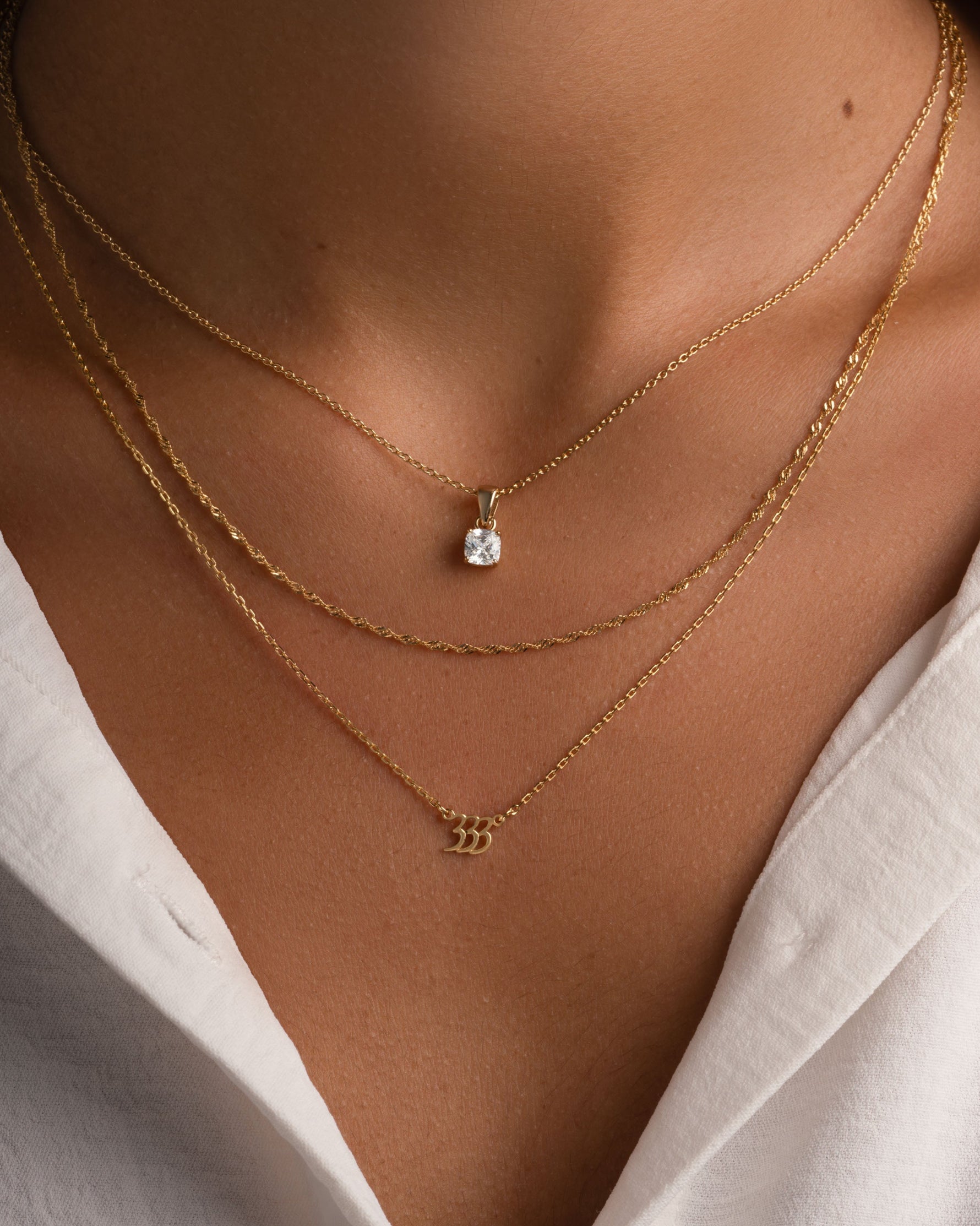 Gold angel number necklace from Sami Jewels featuring the number 333 pendant on a delicate chain.