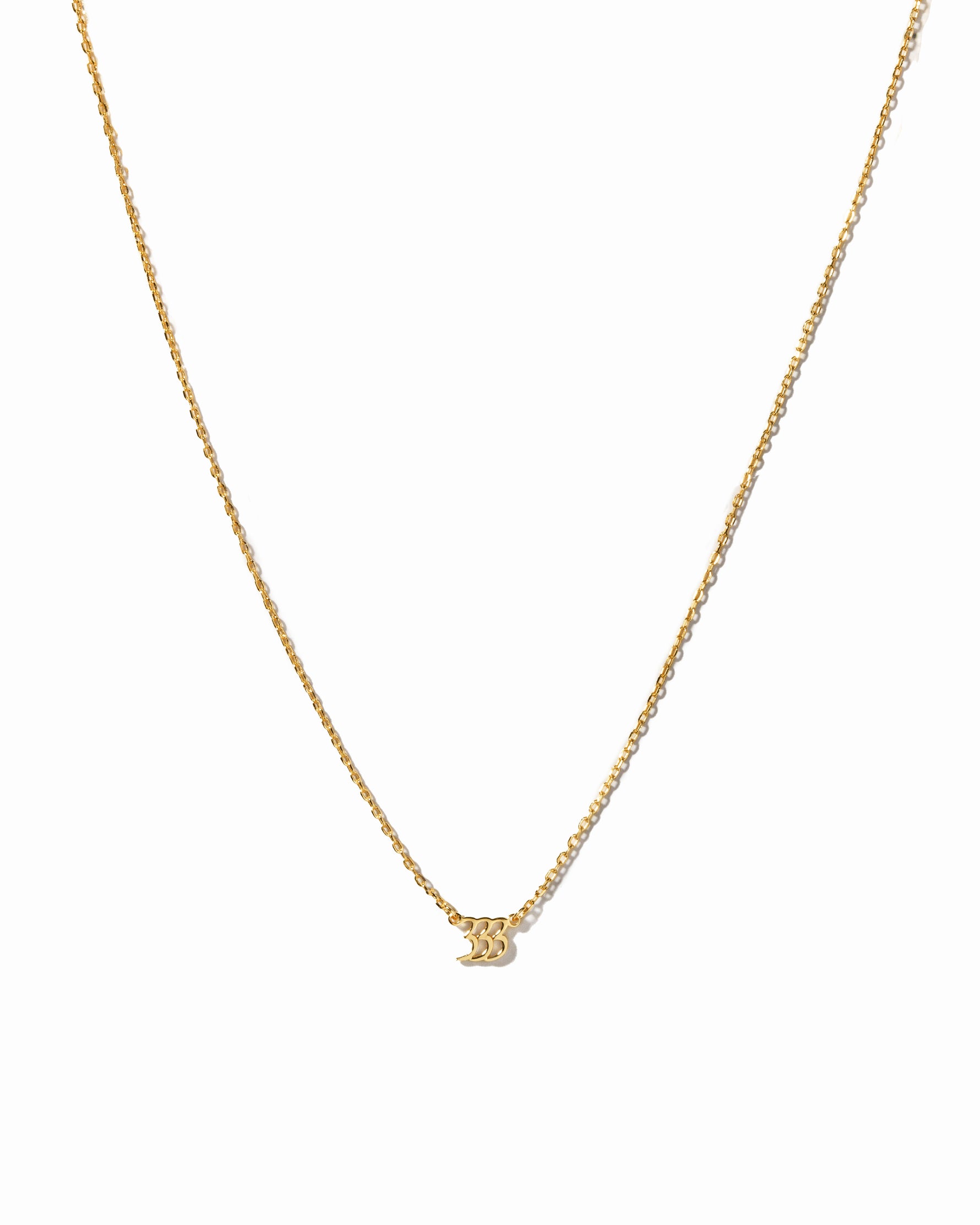 Gold angel number 333 necklace from Sami Jewels, featuring a delicate chain and a pendant with the angel number design.