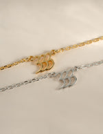 Sterling silver and gold angel number 333 necklace from Sami Jewels, featuring a sleek, modern design on a delicate chain.
