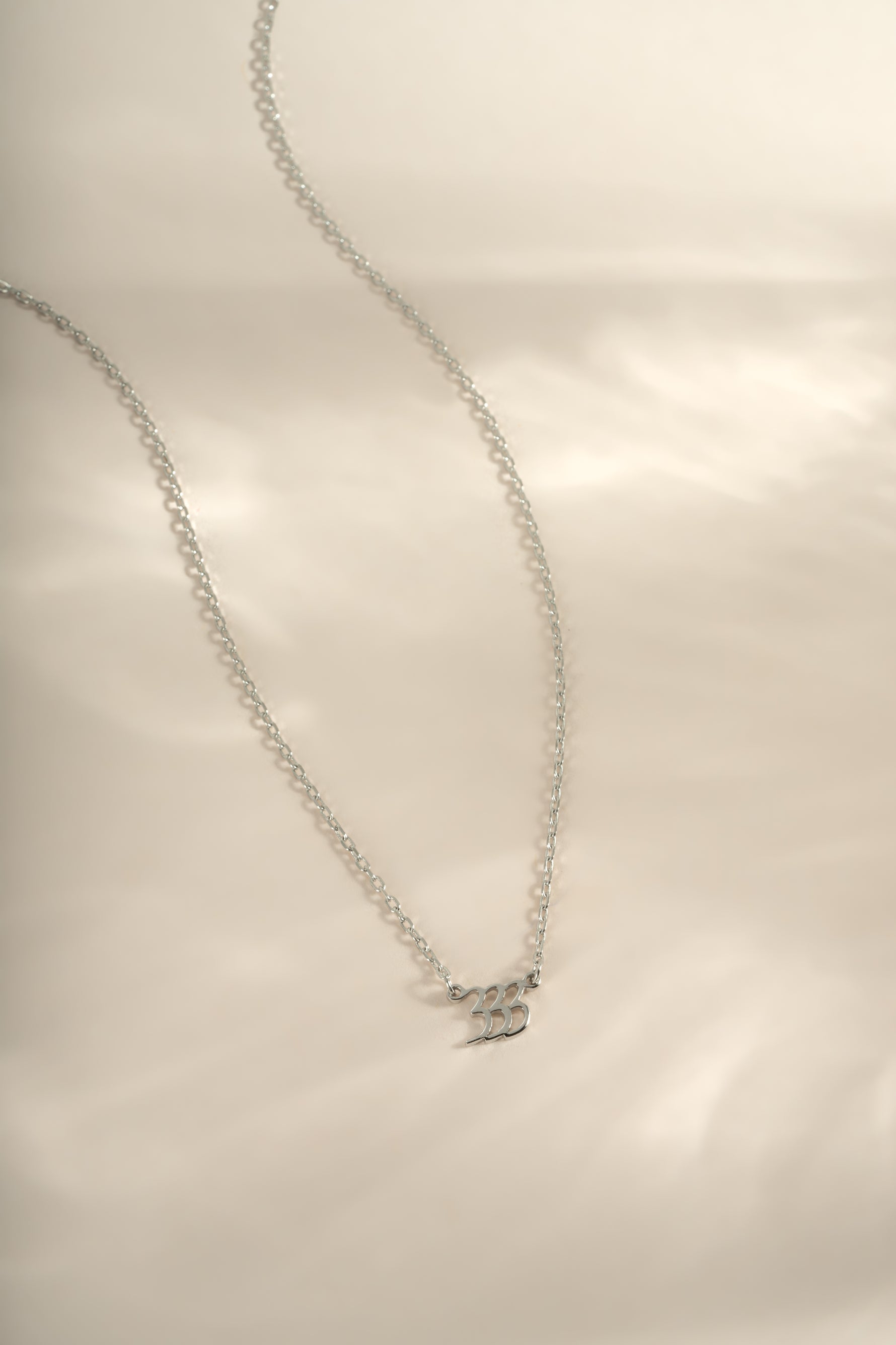 Sterling silver angel number 333 necklace by Sami Jewels, featuring a delicate pendant design on a fine chain.