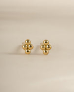 Gold 4-ball stud earrings by Sami Jewels, front view showing shiny spherical design on each earring.