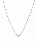 Gold angel number 444 necklace by Sami Jewels displayed on a white background, showcasing a delicate jewelry piece.