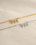 Sterling silver and gold angel number 444 necklace by Sami Jewels, showcasing a delicate pendant design.